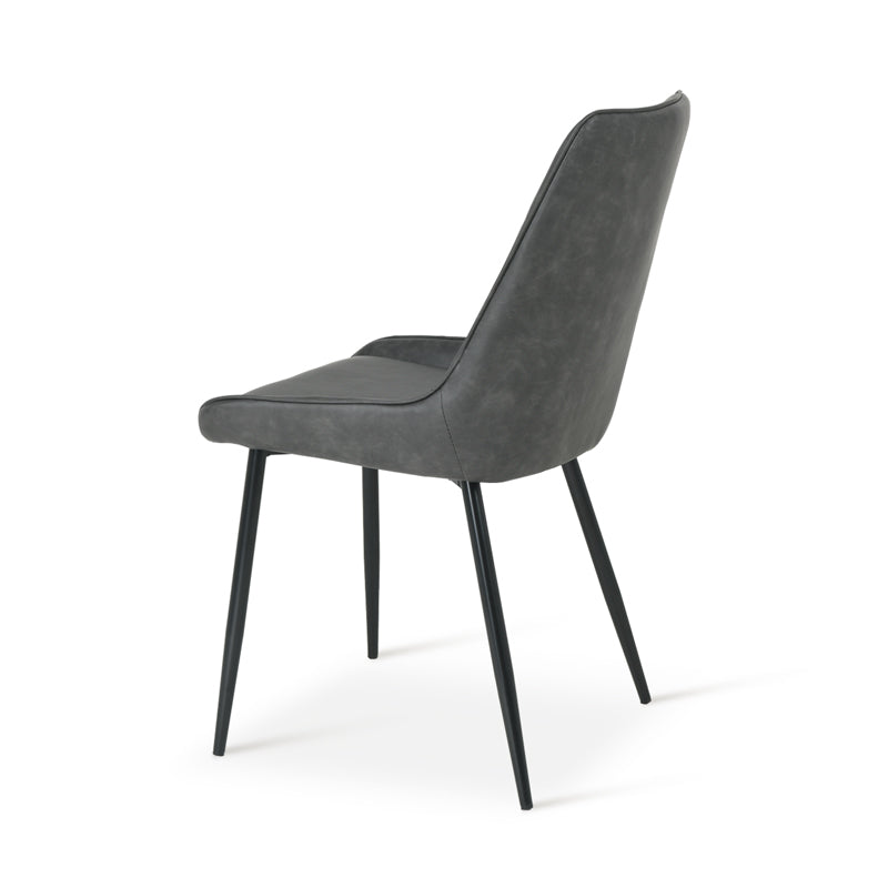 Cheap dining chairs styled with wooden table in small flat Space saving dining chairs tucked under kitchen island | Value furniture Modern budget dining chairs in family home setting