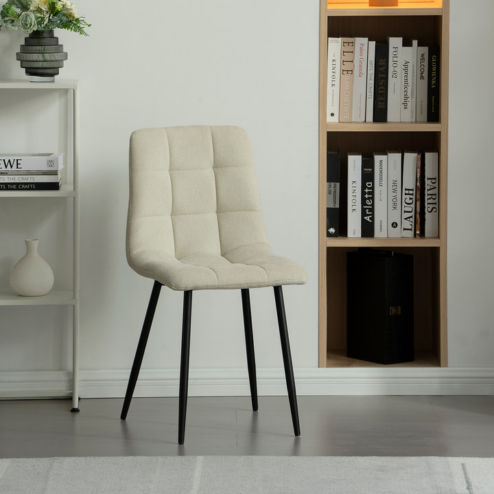 Experience comfort and style with Aoife Dining Chairs: linen blend upholstery, diamond grid stitching and slender metal legs for modern elegance. Modern budget dining chairs in family home setting