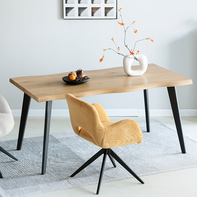 Add instant character to your UK home with the OFCASA Beatrix Dining Table. Featuring a warm wood grain melamine tabletop and sleek black metal legs, perfect for family meals or evening drinks.
Modern budget dining table in family home setting
