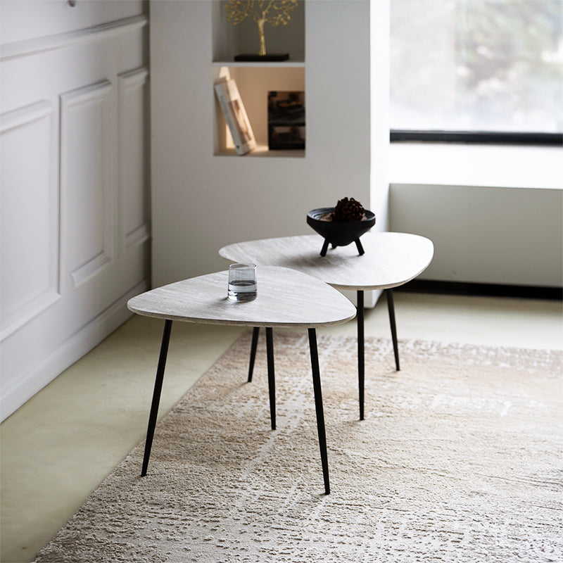 Redefine your lounge with the Piper Coffee Table Set: two sculptural triangular travertine look tabletops on slim metal legs for chic, modern versatility.
Modern budget dining table in family home setting