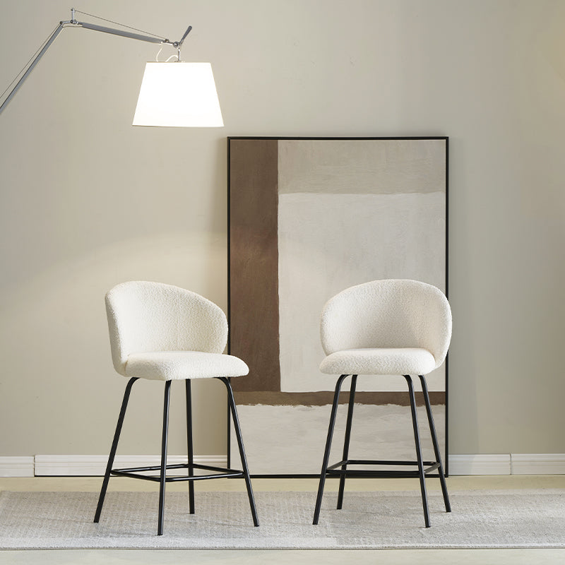 Upgrade your kitchen island with OFCASA Yasin Boucle Bar Stools. Plush boucle upholstery and sturdy metal frame for cosy, stylish UK seating. Space saving bar stools tucked under kitchen island | Value furniture