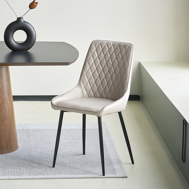 Cheap Barstools UK | Affordable Sets |OFCASA. A high back faux leather dining chair with a diamond grid pattern on the backrest, beige in color, seated on a metal leg.