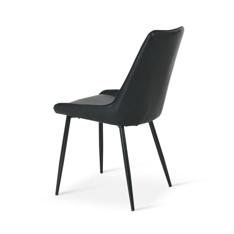 Space saving dining chairs tucked under kitchen island | Value furniture
Modern budget dining chairs in family home setting
black effect cheap dining chairs in bright kitchen diner