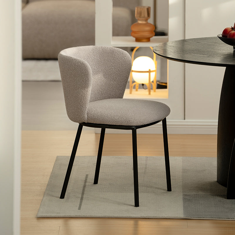 Upgrade your dining space with Karin's mid-century modern chairs. Features curved solid wood legs & premium boucle. Shop now for timeless design & comfort.