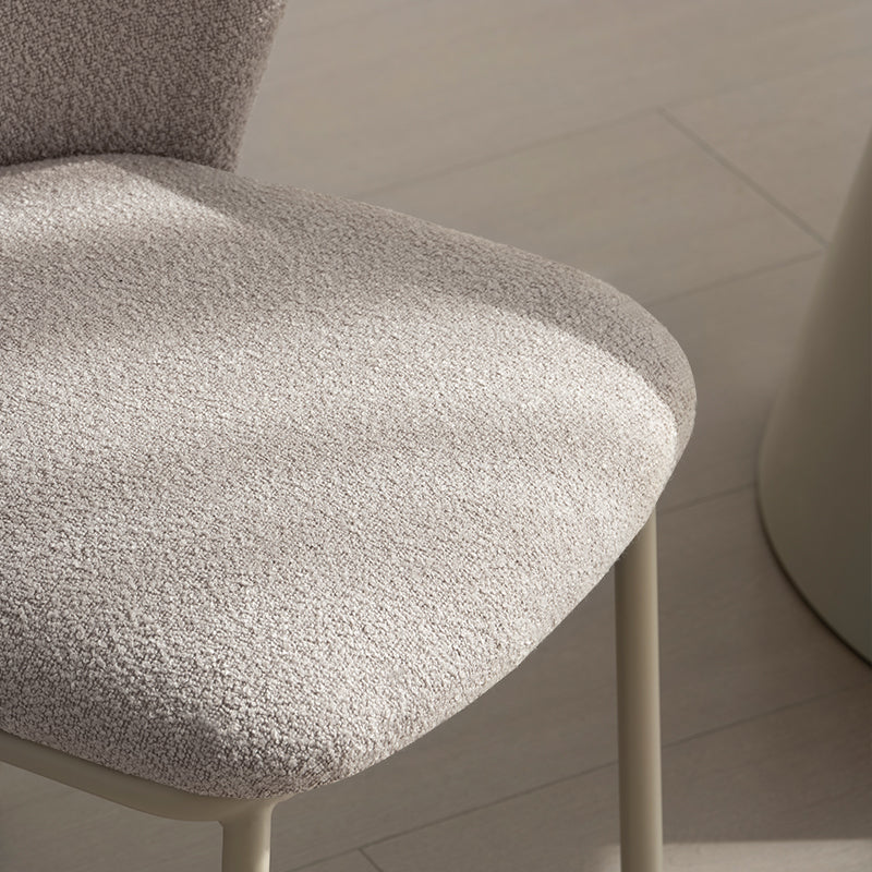 Upgrade your dining space with Karin's mid-century modern chairs. Features curved solid wood legs & premium boucle. Shop now for timeless design & comfort.