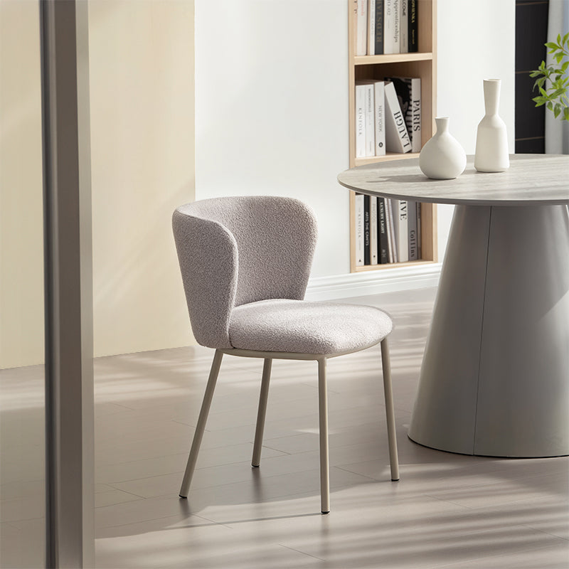 Upgrade your dining space with Karin's mid-century modern chairs. Features curved solid wood legs & premium boucle. Shop now for timeless design & comfort.