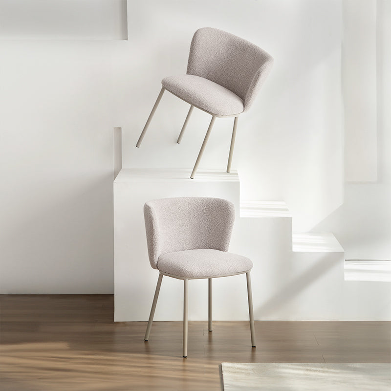 Upgrade your dining space with Karin's mid-century modern chairs. Features curved solid wood legs & premium boucle. Shop now for timeless design & comfort.
