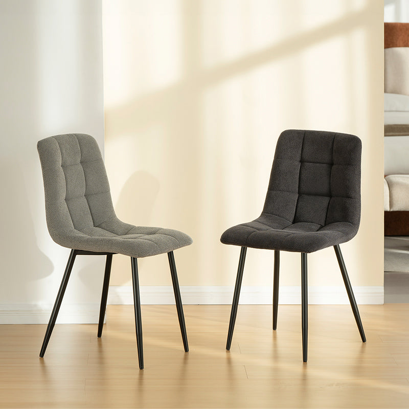 Experience comfort and style with Aoife Dining Chairs: linen blend upholstery, diamond grid stitching and slender metal legs for modern elegance.