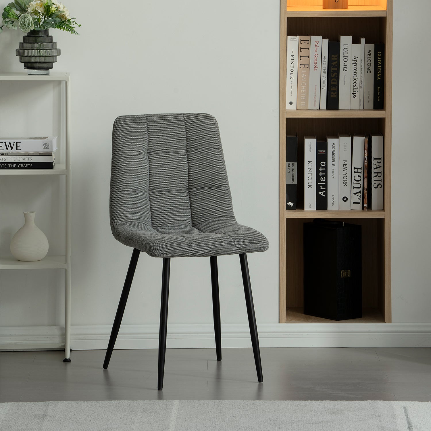 Experience comfort and style with Aoife Dining Chairs: linen blend upholstery, diamond grid stitching and slender metal legs for modern elegance.
