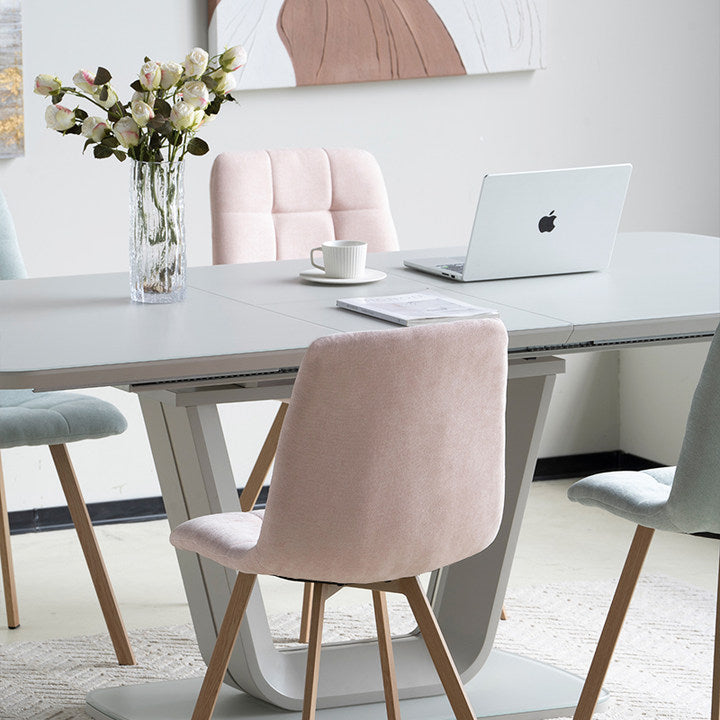 Refresh your dining space with the Aoife Sleek Chairs—quilted linen upholstery, oak-tone metal legs, and a slim profile for effortless modern style.