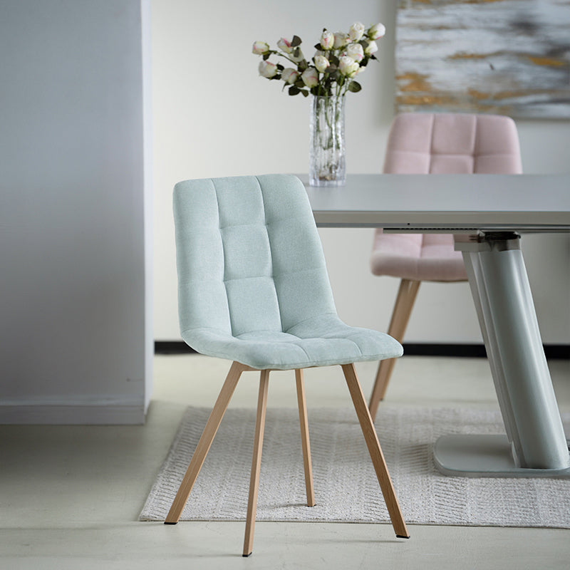Refresh your dining space with the Aoife Sleek Chairs—quilted linen upholstery, oak-tone metal legs, and a slim profile for effortless modern style.