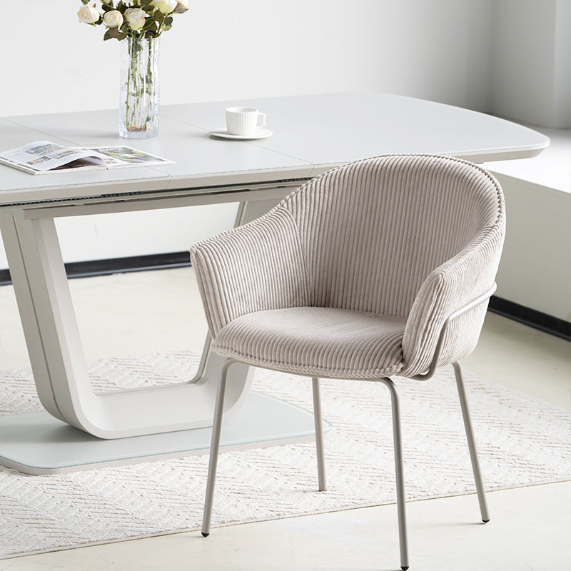 Dress your dining space in luxury with Beatrix Dining Chairs: plush corduroy velvet upholstery and gleaming gold legs for comfort and elegance.