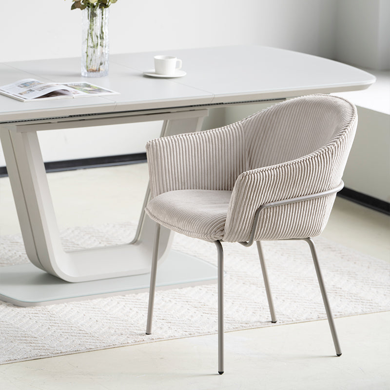 Dress your dining space in luxury with Beatrix Dining Chairs: plush corduroy velvet upholstery and gleaming gold legs for comfort and elegance.