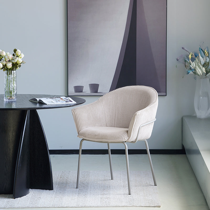 Dress your dining space in luxury with Beatrix Dining Chairs: plush corduroy velvet upholstery and gleaming gold legs for comfort and elegance.