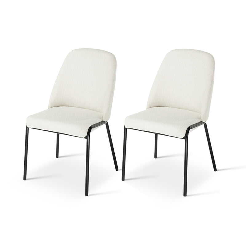 Upgrade your dining or workspace with the Danica Boucle Dining Chairs from OFCASA. Soft, sculptural seats on slender black legs bring Scandinavian style and lasting comfort to any room.