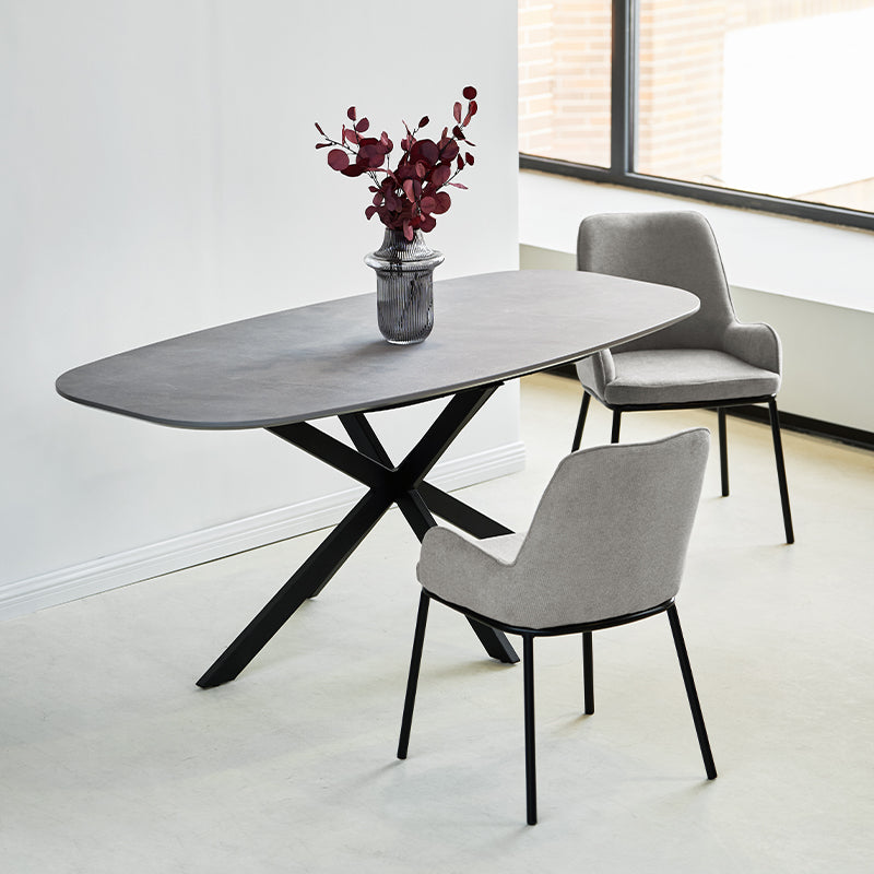 Discover the OFCASA Geena Ellipse Dining Table in grey marble melamine with black crossed metal legs. 180 cm seats six, durable & easy clean—ideal for modern UK dining.