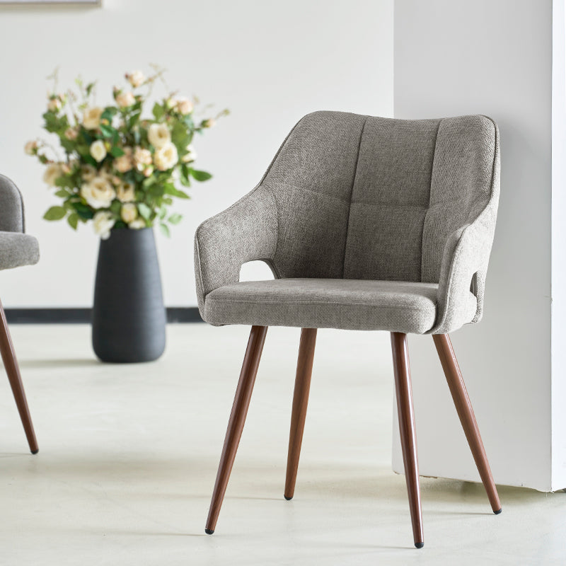 Discover the OFCASA Sage Dining Chairs: soft linen upholstery, wood effect walnut metal legs, and cozy armrests—perfect for stylish, durable UK dining settings.