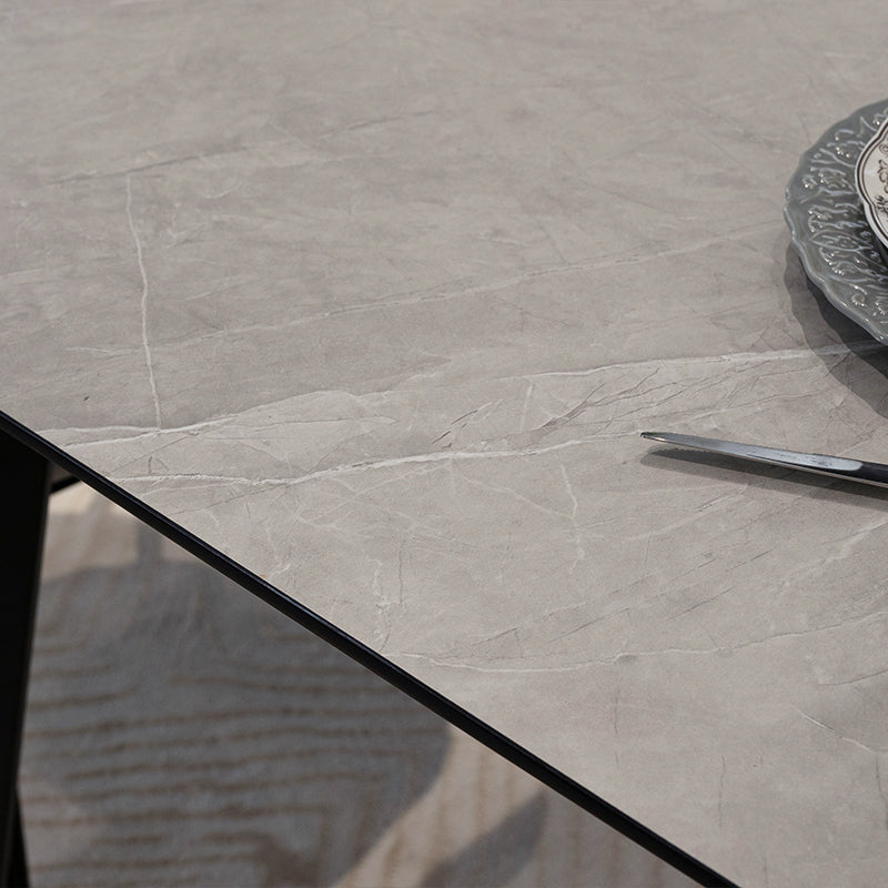 Discover the OFCASA Valdez Dining Table: 140 cm grey marble–effect top, sturdy black metal legs, and easy assembly. Perfect for modern UK dining spaces.