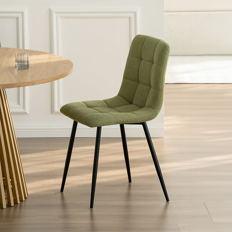 Experience comfort and style with Aoife Dining Chairs: linen blend upholstery, diamond grid stitching and slender metal legs for modern elegance. Modern budget dining chairs in family home setting
