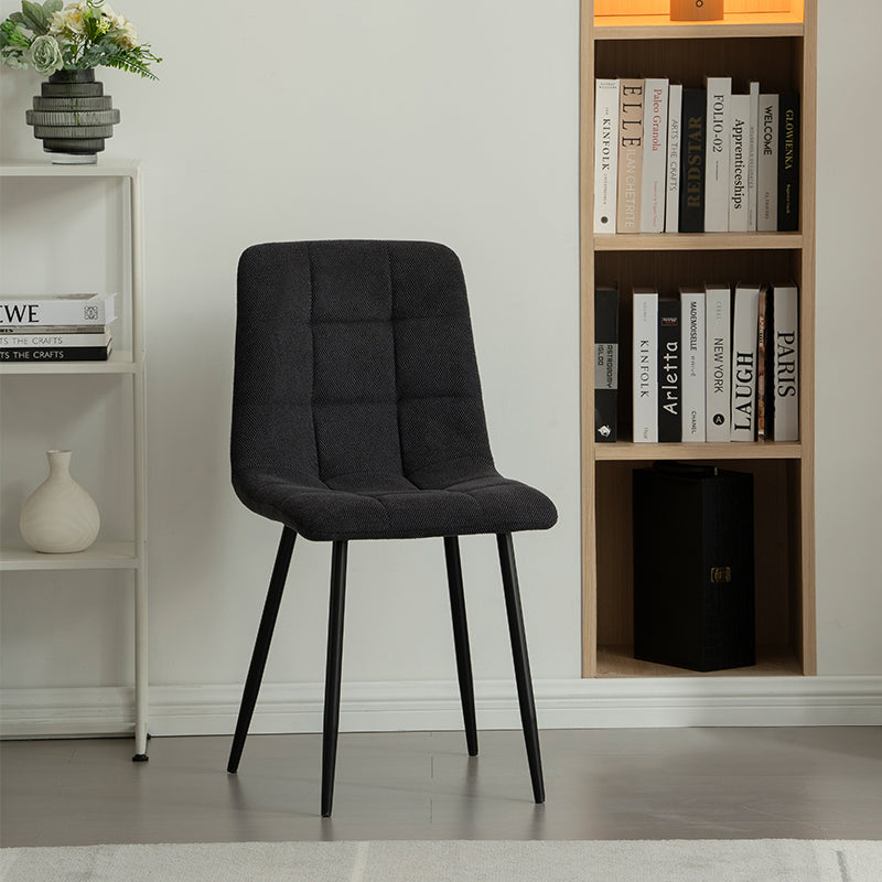Experience comfort and style with Aoife Dining Chairs: linen blend upholstery, diamond grid stitching and slender metal legs for modern elegance.
Modern budget dining chairs in family home setting