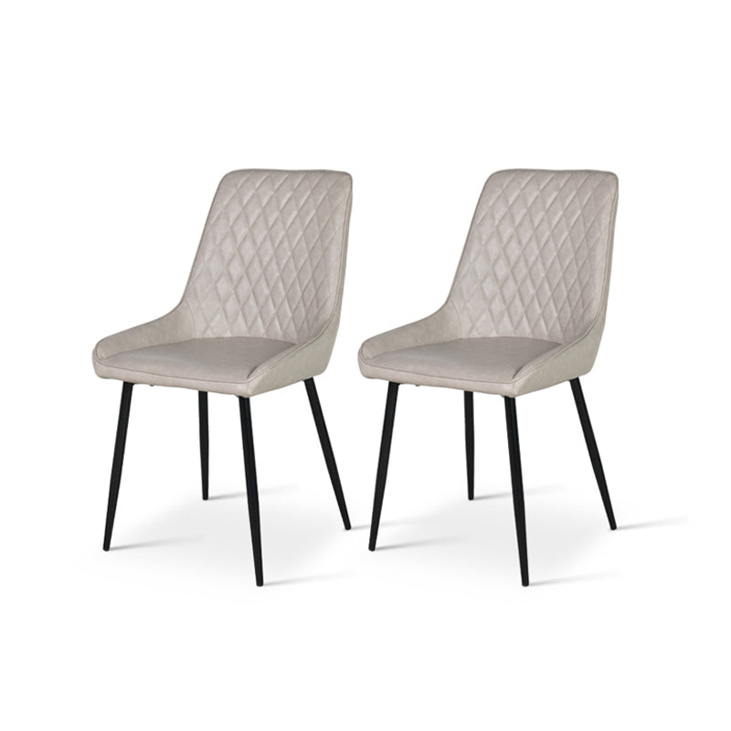 A high back faux leather dining chair with a diamond grid pattern on the backrest, beige in color, seated on a metal leg. Cheap Barstools UK | Affordable Sets from £xx |OFCASA