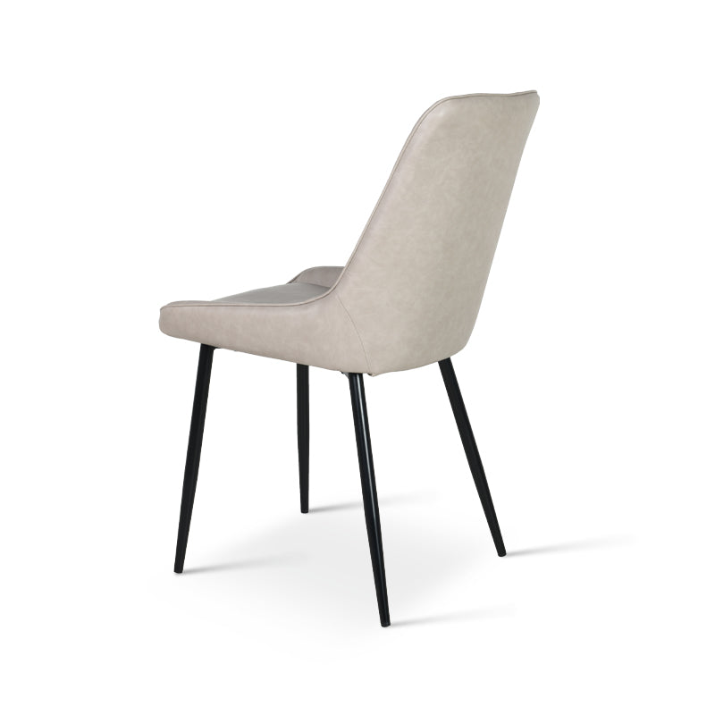 Side view of budget dining chair showing balck legs | Affordable seating
Close up of pu leather texture on cheap dining chairs UK
Backrest detail of budget pu dining chair | Value dining chairs