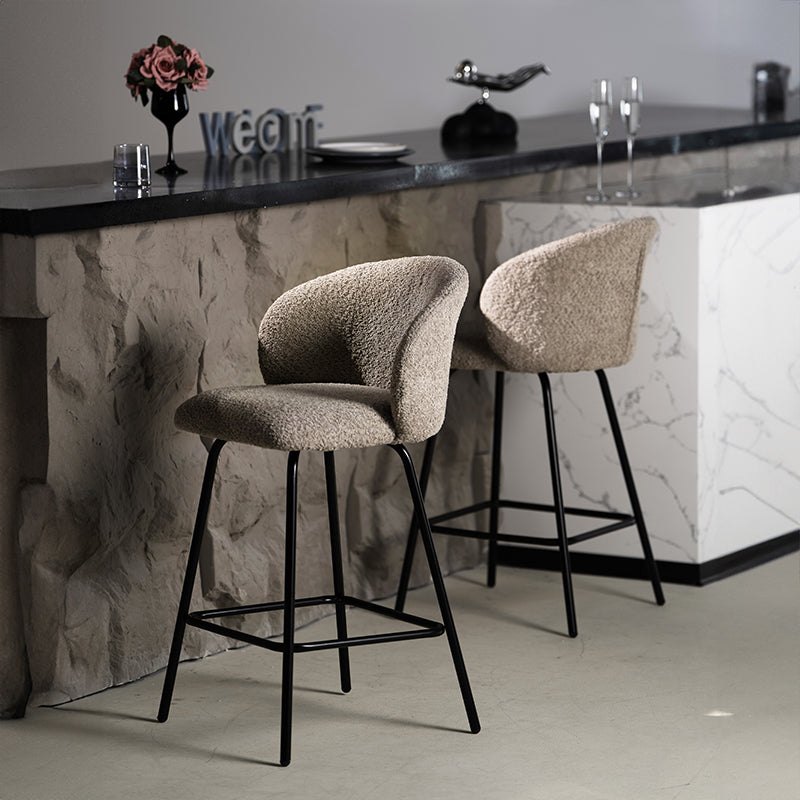 Upgrade your kitchen island with OFCASA Yasin Boucle Bar Stools. Plush boucle upholstery and sturdy metal frame for cosy, stylish UK seating. Space saving bar stools tucked under kitchen island | Value furniture