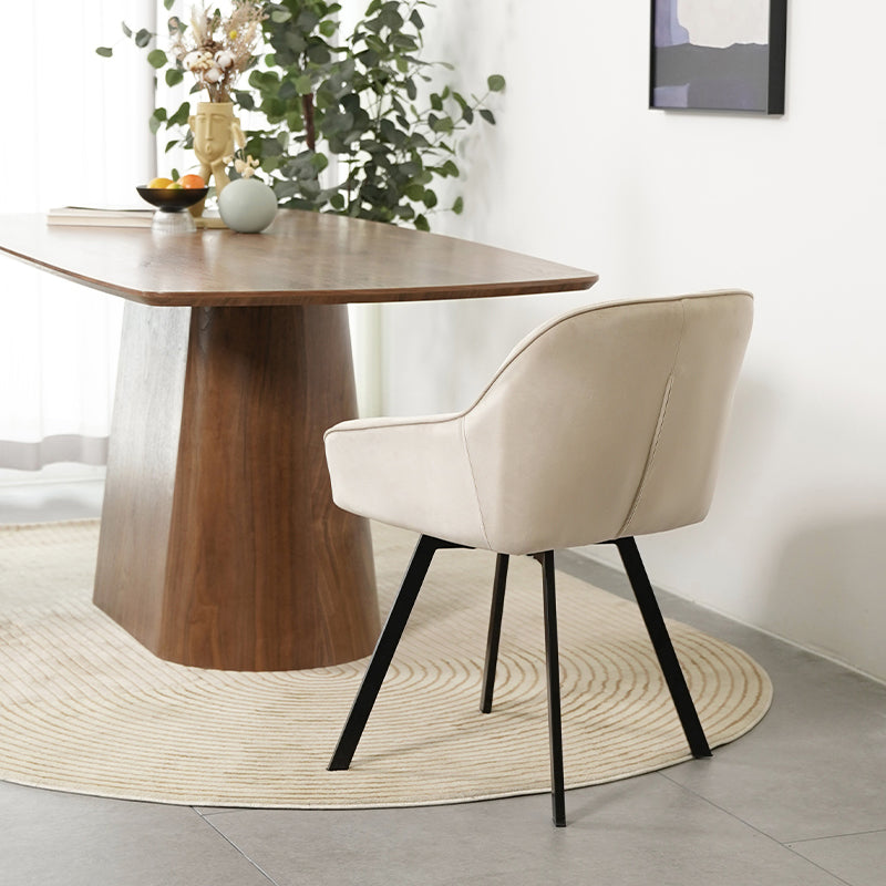 Beige OFCASA Aleena dining chair with cushioned high back and smooth PU leather upholstery, showcasing modern elegance for contemporary dining rooms.Close-up of OFCASA Aleena chair’s smooth PU leather and refined stitching, highlighting durability and a luxury finish.A warm dining scene featuring OFCASA Aleena chairs around a wooden table, ideal for family gatherings and stylish everyday meals.