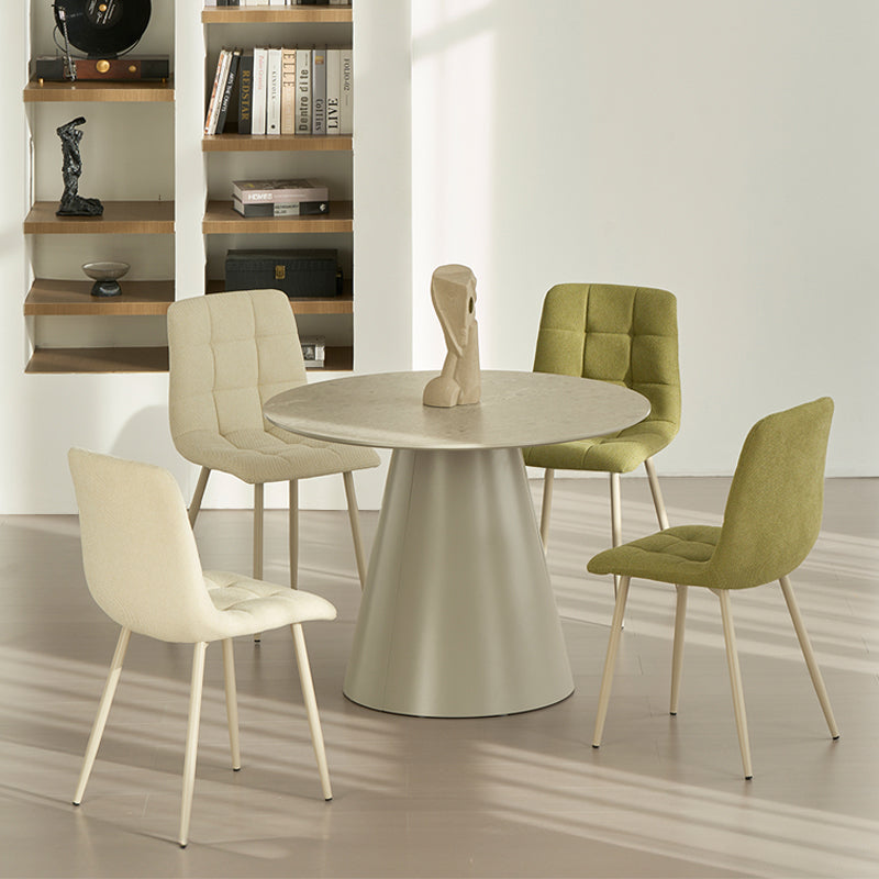 Experience comfort and style with Aoife Dining Chairs: linen blend upholstery, diamond grid stitching and slender metal legs for modern elegance.
