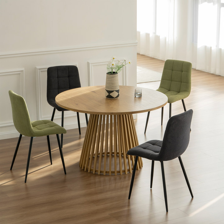 Experience comfort and style with Aoife Dining Chairs: linen blend upholstery, diamond grid stitching and slender metal legs for modern elegance.
