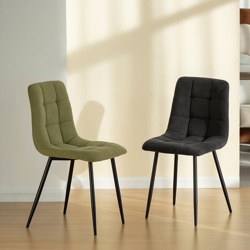 Experience comfort and style with Aoife Dining Chairs: linen blend upholstery, diamond grid stitching and slender metal legs for modern elegance.
