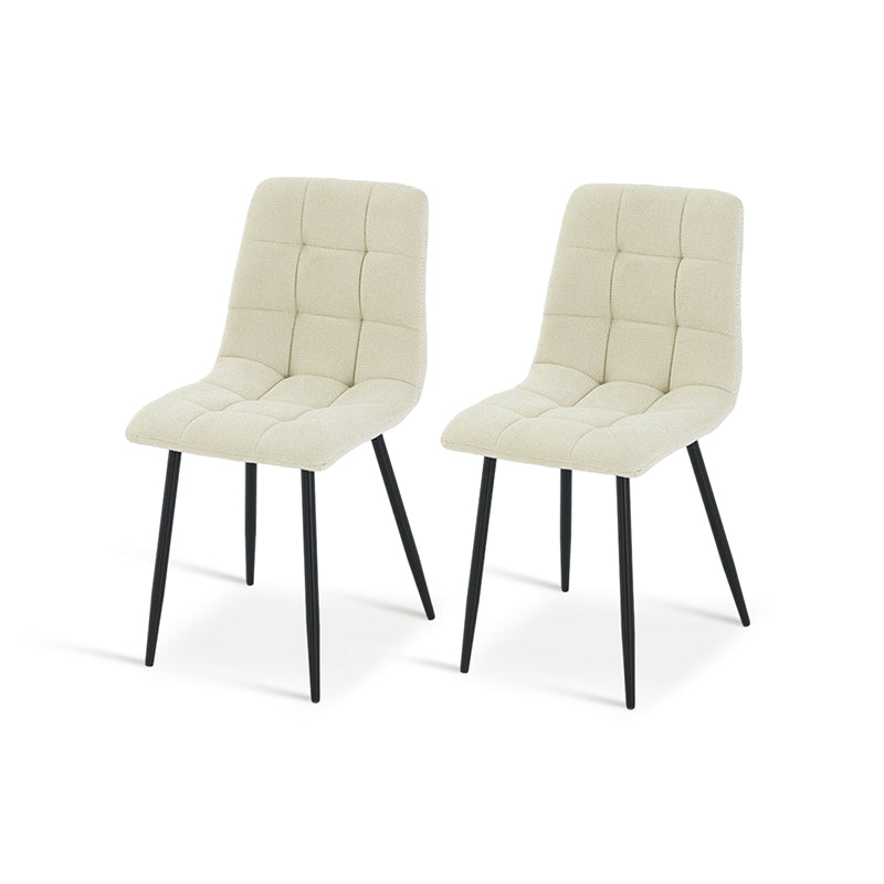 Experience comfort and style with Aoife Dining Chairs: linen blend upholstery, diamond grid stitching and slender metal legs for modern elegance.
