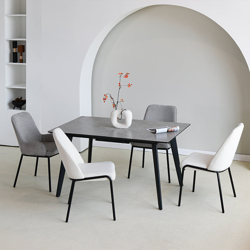 Upgrade your dining or workspace with the Danica Boucle Dining Chairs from OFCASA. Soft, sculptural seats on slender black legs bring Scandinavian style and lasting comfort to any room.
