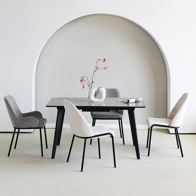 Upgrade your dining or workspace with the Danica Boucle Dining Chairs from OFCASA. Soft, sculptural seats on slender black legs bring Scandinavian style and lasting comfort to any room.

