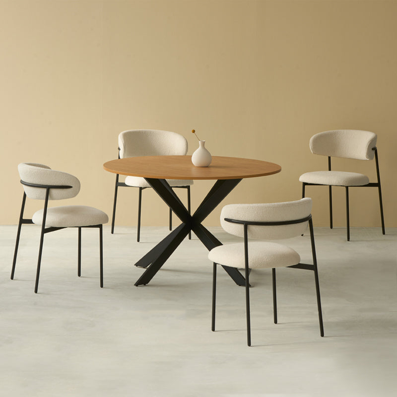 Host stylish dinners with the Tilly round table and four Zahra boucle chairs. Sleek metal legs meet cozy upholstery in this modern five‑piece set.
