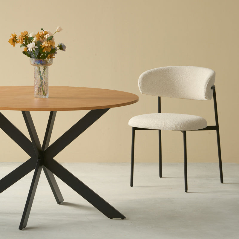 Host stylish dinners with the Tilly round table and four Zahra boucle chairs. Sleek metal legs meet cozy upholstery in this modern five‑piece set.
