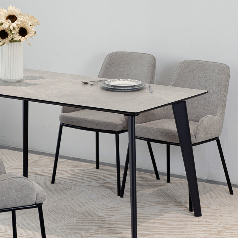 Discover the OFCASA Valdez Dining Table: 140 cm grey marble–effect top, sturdy black metal legs, and easy assembly. Perfect for modern UK dining spaces.